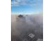 City skyline view with skyscrapers and buildings partially obscured by fog at 150 E Robinson St # 3104, Orlando, FL 32801