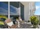 Cozy balcony with wicker furniture, patterned rug, and city views at 150 E Robinson St # 3104, Orlando, FL 32801