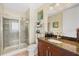 Bathroom with a glass shower, granite countertop vanity, and modern fixtures at 150 E Robinson St # 3104, Orlando, FL 32801