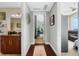 Bright hallway with hardwood floors, leading to living spaces and bedrooms at 150 E Robinson St # 3104, Orlando, FL 32801