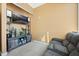 Cozy living room with soft carpet, a television, and a comfortable recliner at 150 E Robinson St # 3104, Orlando, FL 32801