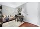 Bright home office with desk and comfortable couch at 150 E Robinson St # 3104, Orlando, FL 32801