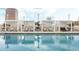 Luxury rooftop swimming pool with lounge chairs and pergola, perfect for relaxation at 150 E Robinson St # 3104, Orlando, FL 32801