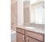 Bathroom features granite countertop vanity, tile shower and large mirror at 169 Magneta Loop, Auburndale, FL 33823