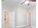 Neutral bedroom with white trim, doors, and ceiling fan at 169 Magneta Loop, Auburndale, FL 33823