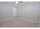 Neutral bedroom featuring carpet, a ceiling fan, and a window with blinds at 169 Magneta Loop, Auburndale, FL 33823