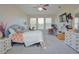 Bright bedroom with ample space, featuring a comfortable bed and a work area at 169 Magneta Loop, Auburndale, FL 33823