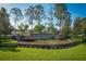 The Estates of Auburndale community entrance with landscaping at 169 Magneta Loop, Auburndale, FL 33823