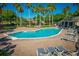 Inviting community pool with plenty of lounge chairs for sunbathing at 169 Magneta Loop, Auburndale, FL 33823