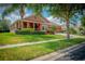 Beautiful one-story home with a three-car garage and well-maintained landscaping at 169 Magneta Loop, Auburndale, FL 33823