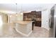 Kitchen featuring a large island with granite countertops, stainless steel appliances, and tile backsplash at 169 Magneta Loop, Auburndale, FL 33823