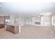 Open-concept living space featuring a modern fireplace, tile floors, and a kitchen island at 169 Magneta Loop, Auburndale, FL 33823