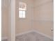 Walk-in closet with metal shelving and a window for natural light at 169 Magneta Loop, Auburndale, FL 33823
