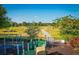 Walking trail winds through grassy field, near playground at 169 Magneta Loop, Auburndale, FL 33823