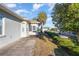 Landscaped backyard with patio and lush greenery at 17478 Se 115Th Terrace Rd, Summerfield, FL 34491