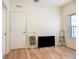 Bright bedroom featuring wood flooring and a large window at 17478 Se 115Th Terrace Rd, Summerfield, FL 34491