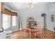 Dining area with table, chairs and a corner hutch at 17478 Se 115Th Terrace Rd, Summerfield, FL 34491