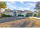 Single-story house with a screened garage and landscaped yard at 17478 Se 115Th Terrace Rd, Summerfield, FL 34491