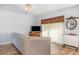 Living room with sectional sofa, wood floors and TV at 17478 Se 115Th Terrace Rd, Summerfield, FL 34491