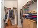 Large walk-in closet with double hanging rods and shelving at 17478 Se 115Th Terrace Rd, Summerfield, FL 34491