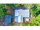 House with metal roof and detached shed, aerial view at 1778 Cr 426, Lake Panasoffkee, FL 33538