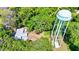 Aerial view showing home and water tower at 1778 Cr 426, Lake Panasoffkee, FL 33538