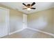 Bright bedroom featuring ceiling fan and hardwood floors at 1778 Cr 426, Lake Panasoffkee, FL 33538