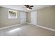 Bedroom with ceiling fan and exterior access at 1778 Cr 426, Lake Panasoffkee, FL 33538