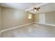 Well-lit bedroom with ceiling fan and hardwood floors at 1778 Cr 426, Lake Panasoffkee, FL 33538