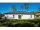 Single story home with a large backyard and sliding glass door at 227 W 4Th St, Chuluota, FL 32766