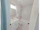 Clean bathroom with a white vanity and bathtub at 227 W 4Th St, Chuluota, FL 32766