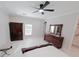 Bright bedroom with wood furniture and large window at 227 W 4Th St, Chuluota, FL 32766