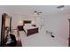 Spacious bedroom with wood furniture and ample natural light at 227 W 4Th St, Chuluota, FL 32766