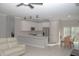 Open concept kitchen with stainless steel appliances and an island at 227 W 4Th St, Chuluota, FL 32766