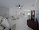 Spacious living room with light flooring and a view of the kitchen at 227 W 4Th St, Chuluota, FL 32766