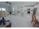 Open living space with recessed lighting and light colored furniture at 227 W 4Th St, Chuluota, FL 32766
