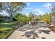 Relaxing backyard oasis with lush landscaping and patio seating at 230 W Spring Lake Dr, Altamonte Springs, FL 32714