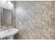 Small bathroom with pedestal sink and patterned wallpaper at 230 W Spring Lake Dr, Altamonte Springs, FL 32714