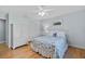 Bedroom with hardwood floors, light blue walls, and a queen-size bed at 230 W Spring Lake Dr, Altamonte Springs, FL 32714