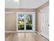 Bright bedroom with hardwood floors, large window, and ample natural light at 230 W Spring Lake Dr, Altamonte Springs, FL 32714