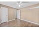 Spacious bedroom featuring hardwood floors and ceiling fan at 230 W Spring Lake Dr, Altamonte Springs, FL 32714
