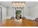 Elegant dining room with large wood table and chandelier at 230 W Spring Lake Dr, Altamonte Springs, FL 32714