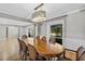 Bright dining room featuring a spacious table and chandelier at 230 W Spring Lake Dr, Altamonte Springs, FL 32714
