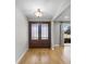 Bright entryway with hardwood floors and double doors leading into the home at 230 W Spring Lake Dr, Altamonte Springs, FL 32714