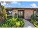 Brick house with a double wooden door and well-maintained landscaping at 230 W Spring Lake Dr, Altamonte Springs, FL 32714