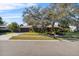 House exterior showcasing landscaping and driveway at 230 W Spring Lake Dr, Altamonte Springs, FL 32714