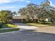 House with nicely landscaped yard and driveway at 230 W Spring Lake Dr, Altamonte Springs, FL 32714