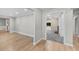 Light and airy hallway with hardwood floors and neutral wall colors at 230 W Spring Lake Dr, Altamonte Springs, FL 32714