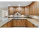 Kitchen boasts granite countertops and wood cabinets at 230 W Spring Lake Dr, Altamonte Springs, FL 32714