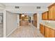 Open kitchen with granite countertops and tile flooring at 230 W Spring Lake Dr, Altamonte Springs, FL 32714